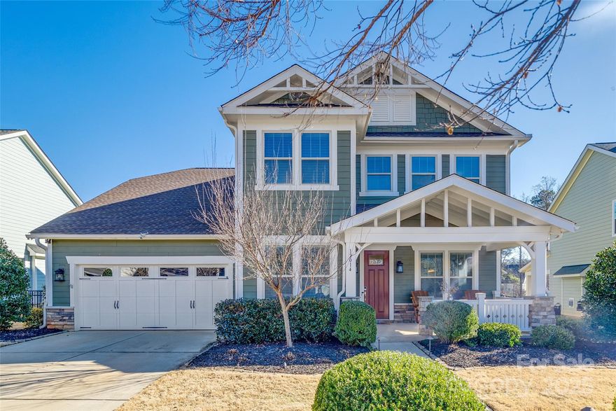 Welcome to one of THE most beautiful homes in the neighborhood! Step inside to discover main floor living with designer flooring throughout.  Gorgeous kitchen overlooking a spacious living room, with a convenient butler's pantry, makes entertaining a breeze. The layout offers multiple areas for office/study space. The flow of this floorplan makes living here so comfortable!  Make the big bedroom upstairs an office, media room, whatever fits your needs. The backyard features a fabulous outdoor area, featuring a covered grilling station, elegant pavers, lush landscaping for added privacy, and a peaceful backdrop that’s sure to impress. The garage features epoxy-finished flooring with ample storage space.The community amenities enhance the lifestyle with a kayak launch to Lake Wylie, walking trails, and a stunning pool and clubhouse.Every detail in this home has been added to offer a lifestyle of comfort and luxury. There’s truly nothing left to be desired in this exceptional property!