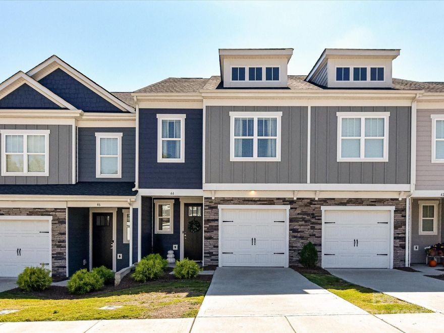Beautifully maintained 3-bedroom, 2.5-bath townhome with 1-car garage and private enclosed patio, located in a desirable and revitalized community. Walk the greenway to shops, parks, restaurants, and bars while enjoying a convenient, low-maintenance lifestyle. Open floor plan features upgraded kitchen with quartz countertops, stainless steel appliances, large island with seating and storage, pantry, ample cabinetry, upgraded lighting, and dining area. Main level includes high-end LVP flooring and abundant natural light throughout. Upstairs offers a versatile loft/flex space, spacious primary suite with chandelier, walk-in closet, and private bath featuring dual quartz vanity and walk-in tiled shower. Two additional bedrooms, a bathroom and laundry room complete the upper level. An inviting home with modern finishes, ideally situated for move in ready, leisure living. Refrigerator, washer & dryer to convey with acceptable offer.