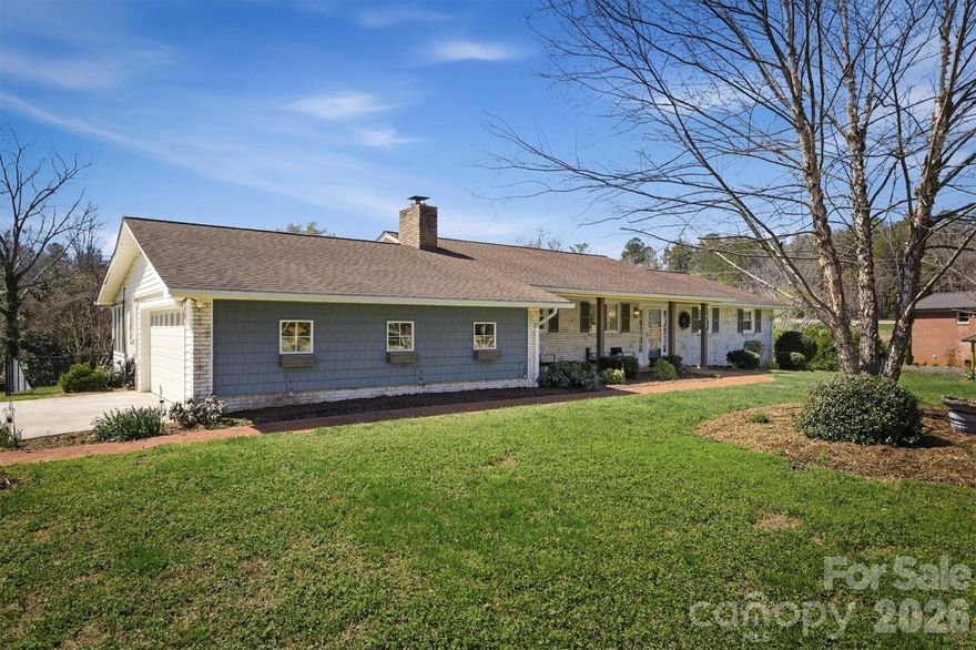 BACK ON MARKET AT NO FAULT OF SELLER!!!! Charming brick ranch with great curb appeal and a welcoming front porch! Step inside to a warm entry foyer that leads into a well-appointed kitchen featuring granite countertops, a gas cooktop, wall oven, and ample cabinetry for storage. The kitchen flows seamlessly into a cozy sitting area with a wood-burning fireplace—perfect for relaxing nights in. Just beyond, you’ll find a light-filled living room with abundant natural light, along with a dedicated dining area. Additionally, the main level features a spacious primary suite with an en-suite bath showcasing a newly updated tile shower, along with two additional bedrooms and a full bath. You’ll also find a sunroom—perfect for all your plants—complete with a gas wall heater, as well as a laundry room with a sink for added convenience. The lower level offers even more flexibility, featuring a room currently used as a bedroom, an office or craft room, a full bath, and a versatile flex space with endless possibilities for use. Approx. 650 sf in basement has a 6’8” ceiling height. You’ll also appreciate the abundance of storage space throughout. This home offers a functional layout, providing both comfort and versatility. Step outside to your own private retreat featuring a heated in-ground pool, spacious patio and deck area perfect for entertaining, and a fully fenced backyard. A partial privacy fence around the pool adds an extra layer of seclusion, making this outdoor space ideal for relaxing or hosting guests. An acre lot, newly built carport with storage space and outbuilding are more highlights of the property. Designed for both everyday living and meaningful moments, this home offers space to gather, relax, and enjoy!