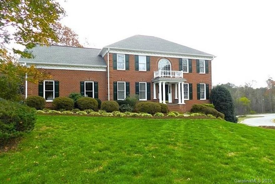 Stately 4 BR, 2.5 BA, Brick Traditional w/Front Columns & Covered Entry. 9' Ceilings, hardwood floors & 2-story foyer welcome you. Open kitchen/great room w/gas FP, white cabinetry, granite counters & new appliances. Formal dining room & library. Second level features MBR w/WIC & spa-like bath. 3 additional BRs & full bath complete the 2nd level. Full unfinished basement w/single garage, work space with peg board & rough plumbed. Composite deck & covered wood ceiling overlook private yard.