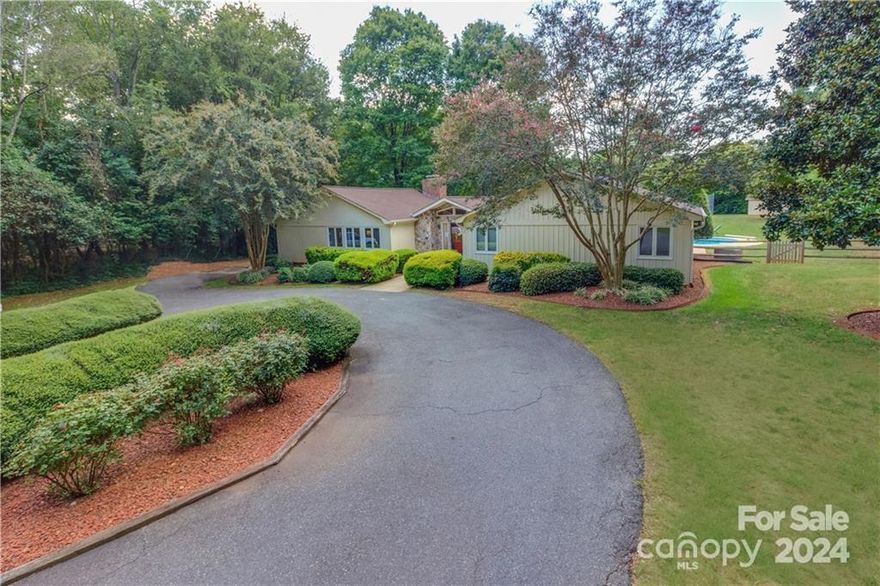 ** Location, location, location** This rare gem is a secluded oasis on a large unique 1.37 acre parcel in the heart of Charlotte. The house is a 3 bedroom, 2 1/2 bath ranch in a beautiful area near some of Charlotte's best schools, cultural activities, and recreation! The location and large lot size make it ideal for subdividing, remodeling or adding additional space. This is perfect opportunity for custom home builders desiring a project with enormous profit potential in a proven neighborhood. The property is min from Myers Park, SouthPark & the Uptown. It's a rare opportunity in this market. The deep, private parcel is almost 500 feet from Sardis Road to the back of the property & over 200 feet wide at the road. The house sits far back from the road with a circular driveway. It includes multiple large living areas. The in-ground pool and full size tennis court with lights will make for outstanding entertaining and family gatherings with lots of privacy. This one won't last long.