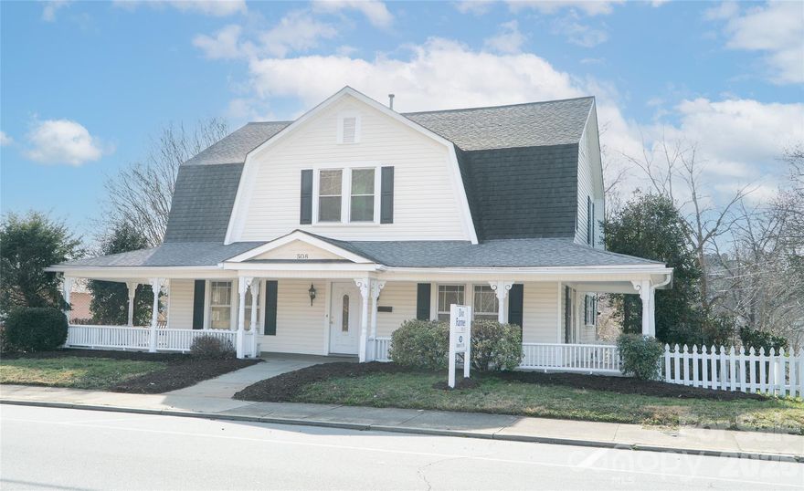 Former historic home now business is located on Mulberry Street across from the UNC Health Caldwell hospital campus in the heart of downtown Lenoir.  Originally built in 1890, the building has been refurbished but maintained many of the historic home's unique features.  2620 square feet in excellent condition, beautiful hardwood floors, arched cased opening to reception/main office with two other large offices on first floor, one with natural gas fireplace.  Main level also includes full kitchen, half bath, laundry/utility room and separate storage room.  Upstairs are three large offices with extensive bookcases and a full bath with shower and vintage vanity sink. Building has basement with several sections and both interior and exterior access.  Central heat and air, natural gas water heater, newer roof and pristine wrap-around porch.  Original fireplace chimneys closed. Other amenities include (approx.) 375 square foot outbuilding with electricity for additional workshop or storage at the rear of the building.  Parallel parking on the street and additional parking in rear just steps from rear entrance.

Zoning is O-I (Office/Institutional) Mulberry is a 5,000 car per day city street, walkable to downtown restaurants, banks, coffee shops, etc.  Lenoir is the County Seat.  Location perfect for financial, medical/dental, legal, administrative commercial business.