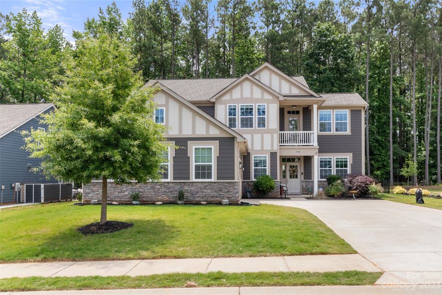 WELCOME to your new home just minutes from Lake Wylie!  Enjoy the open space in this beautiful home as soon as you walk in the front door.   Gourmet kitchen with large granite island/breakfast bar opens to a great room with a fireplace that looks out onto a private fenced in backyard.  An added feature is an office niche off the kitchen for working at home or home working!  Downstairs bedroom suite with full bathroom is conveniently located to provide privacy for a guest or family member.  The upstairs primary bedroom suite includes a covered balcony for your breakfast coffee time or star gazing.  Two other upper bedrooms and a loft creates even more comfortable living space.  Sellers have upgraded the upstairs with hardwood flooring, the kitchen with bright cabinets, the outside living area with an extended patio and installed an air filtration system on the HVAC unit.