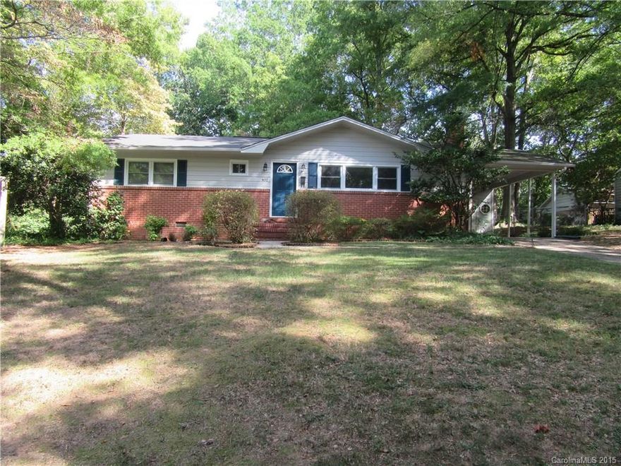 Darling mid century ranch style home.  Updated kitchen/baths, 3 large BRs/ 2 closets in the MBR, attached carport/convenient kitchen entry. Fenced back yard with a sep carport/workshop & out building. Lovely neighborhood close to all shopping & restaurants.  Recently painted and ready for you to move in.  Lots of mature shade trees and just perfect for cookouts.  Original hardwoods and wood burning fireplace.  It's all on one level, perfect for easy living or first time buyers. Move in ready.