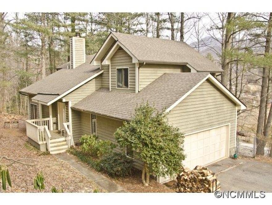 Come see this well priced 4 bedroom Contemporary  home boasting vaulted ceilings, fireplace with built-ins, oak floors in many areas, master suite with walk-in closet, extensive decking for entertaining, rear fenced yard, walk-in crawl space for added storage, 2 car attached garage, low maintenance lot, and more! New Carpeting just installed Aug.2014. Close to Warren Wilson College and amenities! **See Virtual tour**