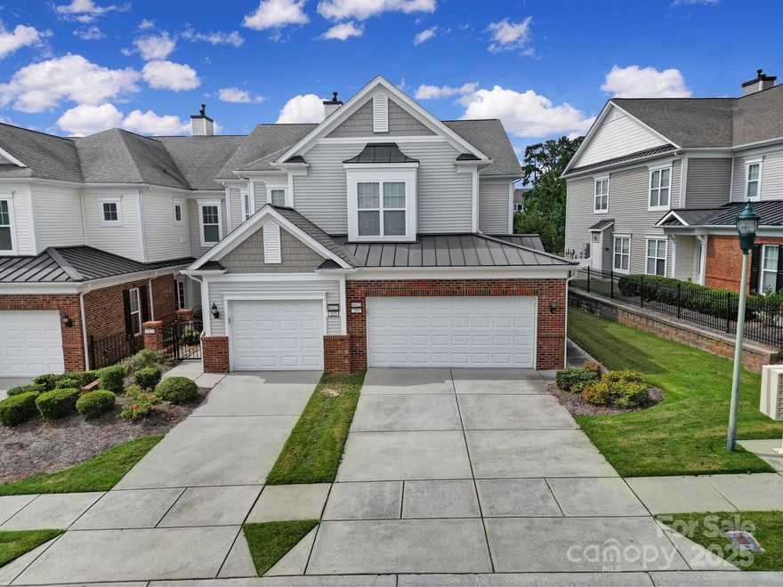 Welcome to this spacious, end-unit Carriage Home in Sun City Carolina Lakes! At the top of the stairs you will find an open floor-plan filled with natural light and stunning crown molding! The screened porch, kitchen, living room, and main bedroom overlook a beautiful lake. The private main bedroom includes a large bath with dual sink vanity, soaking tub, frameless glass shower, and large custom closet! All in 2024: new W/H, marble kitchen backsplash, and freshly painted kitchen cabinets w/ soft-close hinges on doors. All in 2025: New kitchen appliances. Split-plan guest bedroom, large bath with dual vanities, and an office with French doors! Additional features include gas fireplace, large kitchen, SS appliances, formal dining, breakfast nook, laundry room and 2 car garage!  Screened in porch with stunning lake view is perfect for relaxing with coffee or cocktails! Carriage Homes are conveniently located at the front of the neighborhood and close to many of the amazing SCCL amenities.
