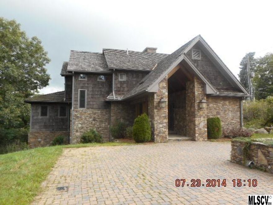 Enjoy spectacular layered mountain views of the gorge to the south and Grandfather Mountain to the west from this bark and stone home within walking distance of downtown Blowing Rock.  Views can be seen from almost every room.  Gourmet kitchen with island, double oven, 6 burner gas range, pot filler,  warming drawers, and ice maker.  Master bedroom suite has stone fireplace, private balcony, and large bath.  Lower level features den with fireplace, bedroom 5, and a full bath.  Elevator available on all 3 floors.   See attachment for PAS requirements and WFHM offer submittal information in MLS document section.