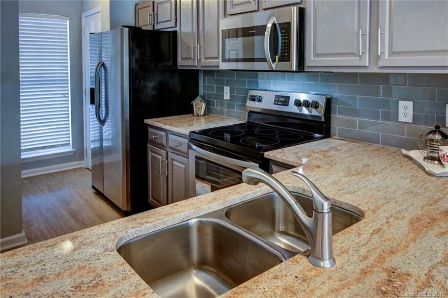 Completely renovated condo overlooking the pool in a lake community!  Amazing location, with easy access to highways, shopping, and dining. This unit is better than new. Renovations include new stainless steel appliances, granite, and tile back splash in the kitchen.  The flooring was updated to a very water resistant EVP for the lake/pool side life style.  The bathrooms also boast granite counter tops.  New brushed nickel faucets, light fixtures, and fresh paint throughout complete the renovations.  Truly move in ready, A must see!