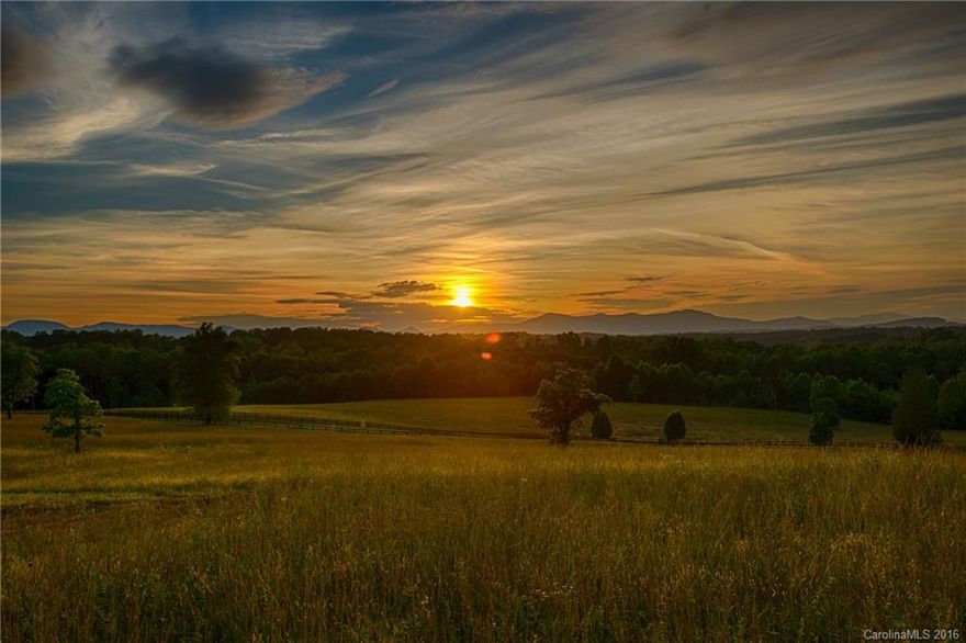 Think Sky’s The Limit – Enjoy the stunning, long range mountain views from your own private paradise. Discover this pristine rolling acreage tucked away on a quiet country road. The 87-acre property offers a private setting with frontage on the Pacolet River, 3-board fencing with established pasture, multiple homesites, and wooded areas of hardwoods and pines. With no restrictions, this parcel is ideal for a private estate, equestrian property or a family legacy property.
