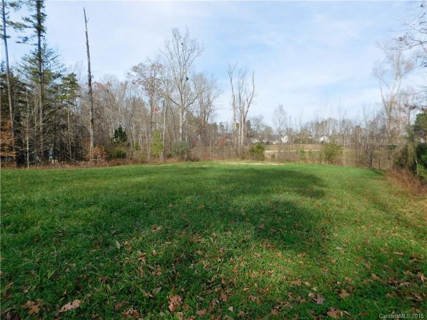 This hard-to-find, large, wooded lot is nestled in the cul-de-sac of a quiet, well-established neighborhood (Tara Plantation) off of Hwy 160 in Fort Mill, just minutes from shopping, dining & I-77.  This lot is perfect for someone wanting to build a custom Plantation or Southern style home with a minimum of 2,000 heated square feet of living space.  The lot is suitable for building a home with a walkout basement.