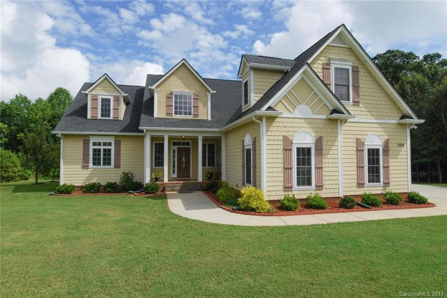 Picture Perfect; DREAM HOME on park-like wooded acre lot. Country-like setting, yet, easy access to I-485. Crown and chair rail molding throughout home. Accent molding & trey ceiling in formal dining. SS appliances, huge center island, 42" cabinets & granite counters in large gourmet kitchen. Living & Bonus are prewired for SSS. Large bedrooms. Huge Sunroom. Walk-in Attic storage.  Water Filtration System. 44" Elite wood fireplace heats up to 3,000 sq. ft. No HOA.