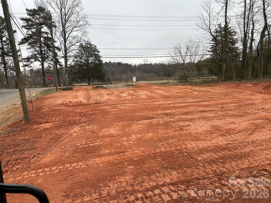 Shovel ready triplex development opportunity in Charlotte minutes from the US National Whitewater Center, Belmont and Mount Holly. Full site plan and sub-lot plat approval by the City of Charlotte, allowing a buyer to move directly into construction without delay. The lot is cleared and pad ready for slab foundation, providing significant upfront cost and time savings, ideal for a smooth and efficient build. Plans call for each unit to have 1,352 heated square feet, 3 beds and 2.5 baths + a 242 square foot garage per unit. Public water and sewer available at the street. The neighborhood and surrounding area continues to see strong growth with hundreds of new construction homes being built in the immediate area. Expansive 15 acre park planned directly across the street. Excellent opportunity for a builder, investor, or first-time ground-up project in a high growth corridor of Charlotte.