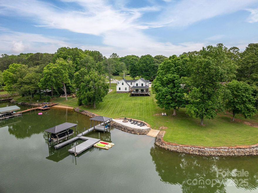 Stunning waterfront home sitting on gorgeous Lake Norman property. This turn key home is sure to please with everything move in ready for your private lakefront Dream home or other potential uses including highly desirable short term rentals. The home includes 3 bedrooms, 3.5 baths, and a large loft area for multiple uses. All appliances and furniture stay. The property features a gorgeous dock with usable covered area for entertaining, a covered boat lift, and two personal watercraft lifts.  Enjoy Custom finishes and detail throughout the gorgeous home. Great quiet location yet convenient to Charlotte, Mooresville, and surrounding Lake Norman Areas. Great news... No HOA. Whether you are looking for a place to enjoy all the luxuries of Lake Norman Waterfront living at its best, or looking for a proven short-term rental location with established history this property is sure to please. Back on Market, No fault of seller!