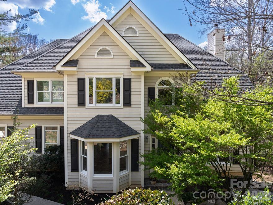 Enjoy year round water views from this amazing East Asheville oasis. Located in the charming Eastmoor by
the River community, this spacious traditional floor plan has great spaces and features including large
bedrooms, generous storage, den/office with vaulted ceilings, open kitchen, and stunning recently
refinished hardwood floors. An additional attic room accessed through a bedroom provides flexible space
for an office, playroom, or private retreat. The finished lower level includes a full apartment with
private entry and deck, offering a bedroom, living area, kitchen, bonus room, full bath with Jacuzzi tub,
laundry, and storage that is ideal for guests, live in in laws, or staff. Watch the birds and fish from
the low-maintenance two-level composite deck. Out front you will love the stone patio with a certified
pollinator garden while out back you can stroll through a riverside meadow with walking paths, wildlife,
and river access! Carpet allowance available with acceptable offer.