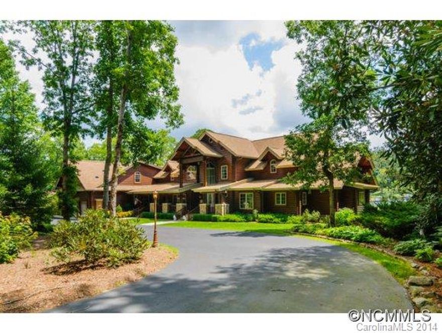 Magnificent Jim Barnum log home on two totally level lots. Paved circular driveway with stone columns and iron gates. Three car garage and 2 stall boat house w/ lifts. Home has 6,910 sq ft and a 30' vaulted living room ceiling. Magnificent log structure ideal for a large family and huge play space in both the front and back yards. Eastern exposure w/ expansive lake views. Outstanding fishing for 8 species of game fish including walleye. B-17/18