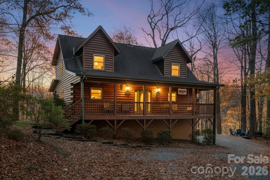 Escape to the mountains in this stunning modern log cabin, perfectly situated in a private, gated community. Offering the ideal balance of tranquility and convenience, this property is just a short drive to Asheville, Old Fort, and Lake Lure, giving you access to the best of Western North Carolina.
Step inside to a warm, inviting interior featuring an open layout, beautiful wood craftsmanship, and modern finishes throughout. Enjoy the outdoors year-round with two spacious covered porches, perfect for morning coffee, evening relaxation, or hosting guests. Unwind after a long day in your private hot tub, surrounded by peaceful forest views.
Whether used as a full-time residence, mountain getaway, or rental investment, this cabin offers comfort, privacy, and sought-after amenities in a desirable mountain setting. The third bedroom in this home is accessed from the lower level.  There are a total of 6 beds and a pull out sofa.  This home also comes furnished. Along with the home comes a magnificent lake for your families enjoyment. There you can canoe or kayak, fish, and picnic.  Throughout the community there are some beautiful waterfalls along with hiking trails.