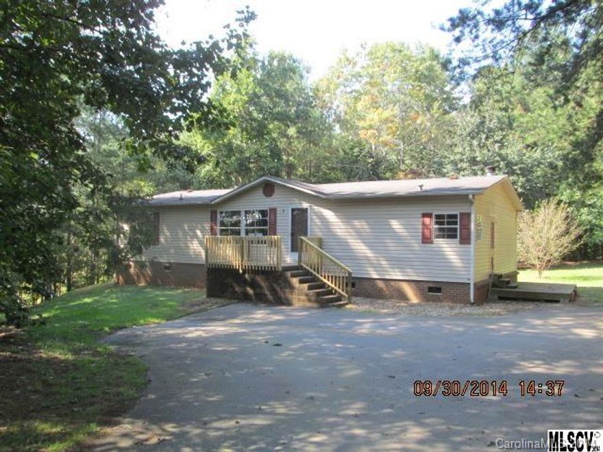 Priced below tax value. 1999 manufactured house with 1404 HSF. Located on a private .77 acre lot. Open floor plan with kitchen, den with fireplace, living room, master bedroom and master bath, and 2 additional bedrooms and hall bath. Just off of Grace Chapel Road. Close to Lake Hickory and Highway 321. This property qualifies under the Freddie Mac First Look Initiative for the first 20 days in MLS.