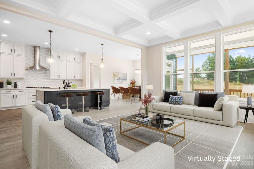 MOVE-IN READY.  Fantastic 4 BR/3.5 BA, Owner Suite Down on large, private, wooded homesite! Epicurean Kitchen, with granite countertops and double ovens, opens to Casual Dining area and Family Room that features coffered ceiling & modern fireplace with shiplap surround & lots of natural lighting, and surrounded by semi-wrap around covered deck! The farmhouse island is perfect for gathering Family & Friends. Coffered ceiling also in Study! Impressive Owner's suite features tray ceiling and huge walk-in closet. Luxurious owner's bath has granite countertops & large walk-in shower! Encapsulated and conditioned crawl space! Some items shown/listed in MLS may have changed during construction.