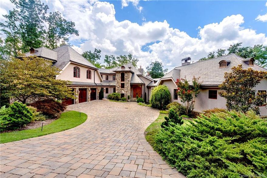 Live like royalty in the Cliffs at Walnut Cove.  This 6300+SF three story home with 3 bedrooms, 5.5 baths, two bonus rooms with baths, an expansive private office and billiard room off master, wine cellar, elegant home theater, 3-car garage, screened porch w/fireplace  and vast outdoor leisure areas is strategically located for convenience near the Cliffs main entrance, tennis courts, golf course and tavern and the wellness center.  A home offering the absolute finest in Cliffs mountain living!