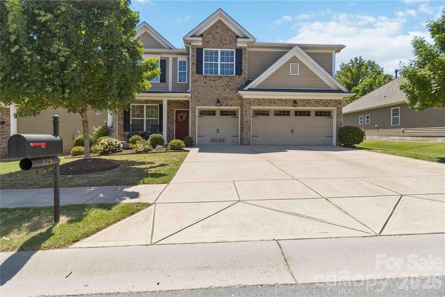 Welcome to 125 Annatto Way! Thoughtful design, generous space, and timeless style come together in this spacious home located in the highly desirable Lake Ridge community of Tega Cay! With 5 bedrooms, 4 full baths, a bonus/game room, and exceptional storage throughout, this home offers the perfect balance of everyday comfort and effortless entertaining.

From the moment you step inside, you’ll feel at home. Natural light fills the open concept layout, highlighting the stylish and durable LVP flooring that flows throughout the main level. At the center of the home, the beautifully appointed kitchen features crisp white cabinetry, gleaming granite countertops, double ovens, and a gas cooktop, all opening seamlessly to the spacious living area so you can stay connected while entertaining guests, enjoying family time, or just relaxing at the end of the day.

A main-level guest bedroom and full bath provide incredible flexibility for visitors, multigenerational living, or a private home office. Upstairs, the expansive primary suite serves as a true retreat, complete with a cozy sitting area, dual walk-in closets with custom Closets by Design organizers, and a spa-inspired bath featuring a soaking tub and a beautifully remodeled shower. Three additional bedrooms on the second floor offer generous space, including one with an en-suite bath, and another full bath conveniently located to the others to maximize comfort for family or guests.

Step outside and enjoy your own private outdoor oasis. The screened porch and paver patio with a stunning fireplace create the perfect backdrop for relaxing evenings, weekend gatherings, and year round enjoyment of the Carolina weather.

Lake Ridge is known for its welcoming community atmosphere and unbeatable location near Lake Wylie, golf courses, parks, shopping, dining, and top-rated Fort Mill schools.

If you’ve been searching for a home that combines space, comfort, and an exceptional location, 125 Annatto Way is the one you’ve been waiting for!