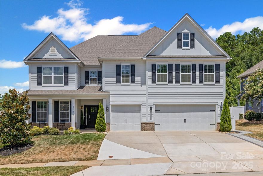 Welcome to this beautiful home in Cypress Point!! 5 bed, 4.5 bath includes luxurious main-level owners suite with  large walk-in closet. Step into the grand open living room with plenty of natural light, elegant stone surrounds the gas fireplace, which leads to the chef's kitchen featuring quartz countertops, a large island, breakfast room and wet bar that flows to the dining room! Luxurious vinyl plank flooring throughout the main living areas. Feel the comfort in all bedrooms with spacious closets. Enjoy outdoor living on the front porch and rear covered porch with seasonal windows, plus a paver patio. The private, fenced backyard provides space and privacy. Additional highlights include a 3 car garage and ample storage throughout. A must-see for buyers seeking space, luxury, and comfort in a thoughtfully designed home! Don't miss this rare opportunity to own in this beautiful neighborhood, steps to the community pool and clubhouse, and minutes to great dining and shopping.