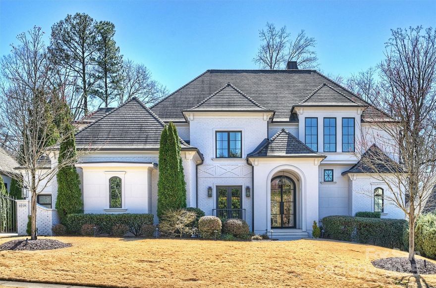 Nestled in a quiet neighborhood, this custom Kingswood home offers modern luxury, convenience, and security. A whole-home Savant system, Lutron lighting, and premium sound system create effortless control. Renovated in 2018 the home features high-end finishes and seamless indoor-outdoor living. At the heart of the home, the stunning kitchen showcases a Majestic range and opens to a beautiful informal dining area featuring a tailor-made banquet. Elegant lighting accents every space. Temperature & humidity-controlled 650-bottle wine cellar, whole house generator and water filtration system. Outdoors, enjoy a putting green, playground, and infinity pool, or relax on the covered terrace. The main level primary suite is a true retreat- its spa-like bath has heated floors, a steam shower and custom closets. The second level  provides a lounge, a gym, and a home theatre. A rare opportunity to own a turn-key luxury home in an unbeatable location near SouthPark in the Quail Hollow area.