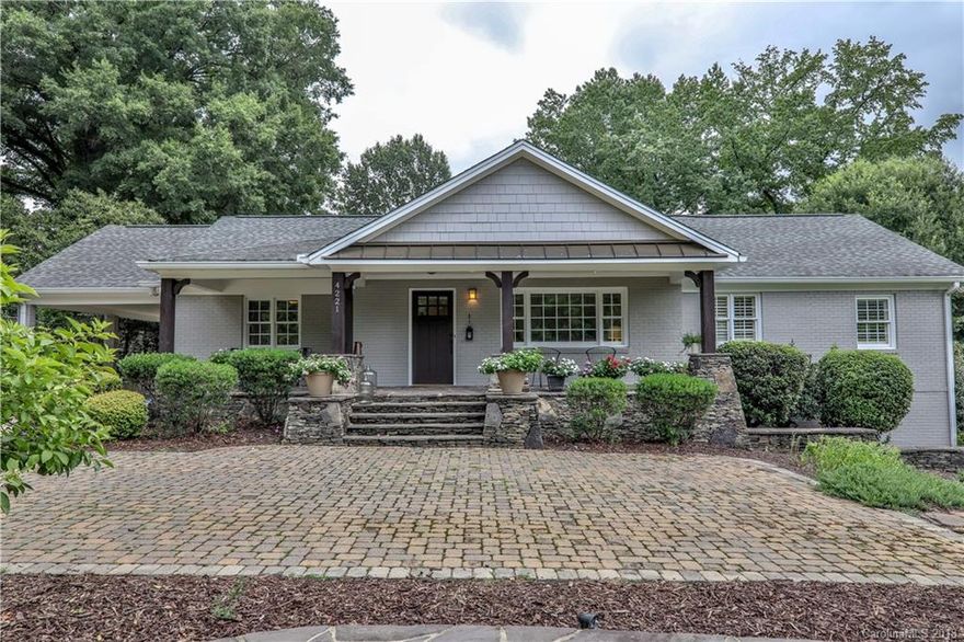 Beautiful, painted brick ranch on one of the hottest streets in Cotswold.  Charming front porch, large enough for rocking chairs and a swing.  Wonderfully updated and maintained, this house is larger than it appears from the front with Family room and Master BR/BA addition on the rear.  Open floor plan with updated kitchen and two brand new bathrooms. 4th bedroom could be a great in-law suite with en suite bathroom. Tankless hot water heater and new HVAC in 2018.  Spacious new deck is the perfect place for outdoor grilling/entertaining. Large flat, 1/2 acre lot with plenty of room for future expansion or garage.  Love this street with a nice mix of established homes and high end new construction and within walking distance to Cotswold Shopping Center.