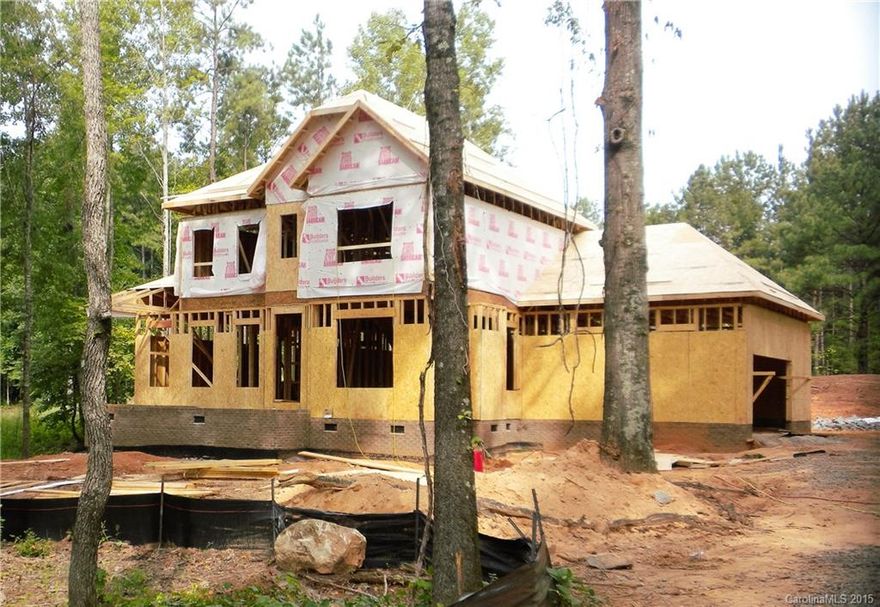 Under Construction!  Lovely Brick-front home situated on over 1+ acre home site w/upgraded landscaping & a well designed floor plan featuring Owner's Suite on Main level.  2-Car Side Load garage w/workshop, storage, and access to Mud Room. Kitchen w/Granite counters, SS appliances - including gas range. Great Room w/Gas log Fireplace, 9' ceilings on 1st floor, Hardwoods, Ceiling Fans, & 1/2 bath on Main. Upper level boasts 3 add'l bedrooms plus loft. 14x14 deck for outdoor entertainment.