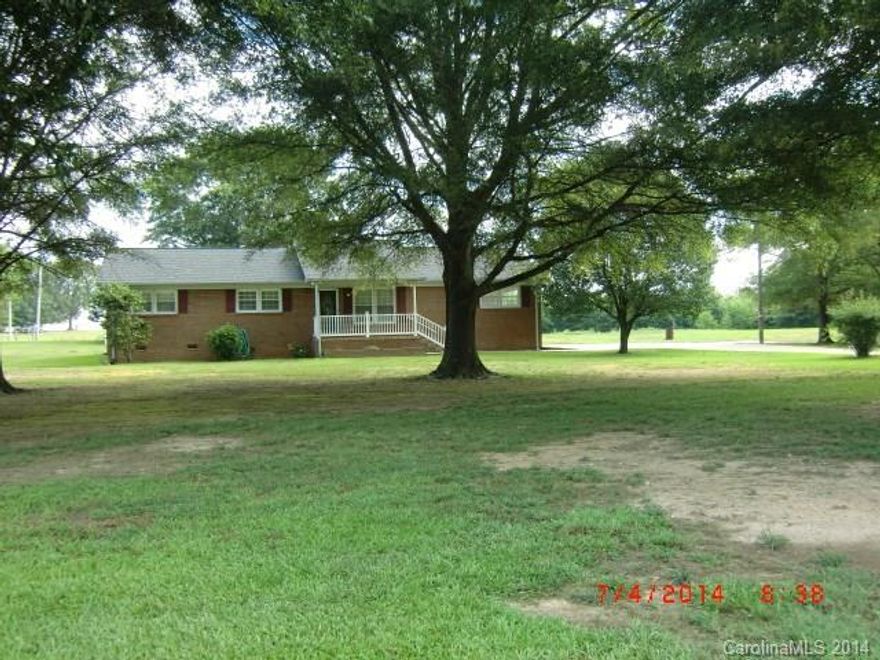 Come home to country living, large shade tree's line the yard of this all brick home, 2 lots, 1.5 acres on both, large shed type building and a storage building on other lot. Home offers lots of cabinet space, open den/living room with fireplace, ready to move in condition. Don't let this one get away.