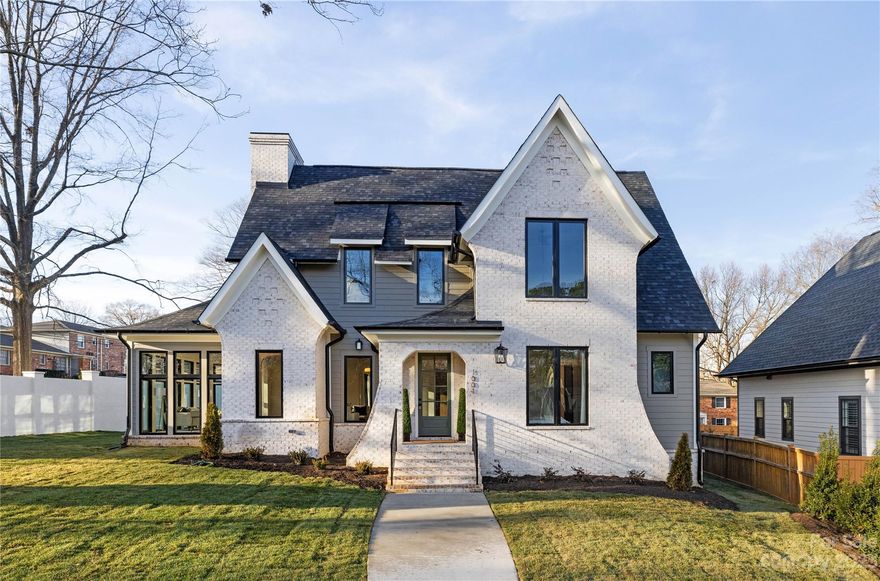 Welcome to 1001 Goshen Place in Cotswold! Crafted by Rivus Construction and designed by Frusterio, this home radiates privacy and luxury. The opulent primary suite boasts vaulted ceilings and oak floors leading to a spa-like ensuite. The main level features an open-concept layout connecting living spaces, including a library nook, sunroom, and chef's kitchen with designer cabinets, quartz countertops, and luxury appliance package. Custom mudroom built-ins ensure impeccable organization. Enjoy the tranquil sunroom with a fireplace or step onto the covered back porch to relax and play in your fully fenced backyard. Upstairs, find a spacious loft and bedrooms, along with a convenient laundry room. Modern comforts include a high-efficiency HVAC, Rinnai tankless water heater, and a sealed crawl space. 1001 Goshen Place offers luxury and comfort in every detail. Immerse yourself in timeless beauty and unparalleled craftsmanship in this haven of sophistication.