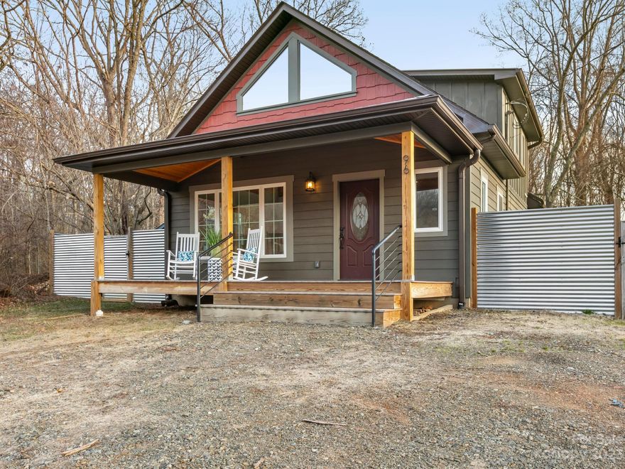 The detail, character & views will exceed expectations. This like-new construction has a mountain oasis vibe & yet is walkable to Frog Level & downtown Waynesville. The front porch, finished with tongue & groove ceilings, is your first step to discovering its mountain rustic charm. Inside you'll find an open living area, vaulted ceilings accompanied by large windows & wood trim that warm the home with natural light. The kitchen includes a live edge island, granite counters with a copper farm sink & walk in pantry. The primary bedroom impresses with tray ceilings & an entrance to the back deck. The bathroom continues to transcend the typical new construction with dual sinks, granite counters & a pebble/tile walk-in shower. The spacious loft has ample room for a multitude of uses: extra bed, office etc. In the backyard, you will find space & privacy to enjoy the view, garden in a plant bed, let your 4-leggeds roam or enjoy a gathering at the firepit. This is quite the enchanting home.