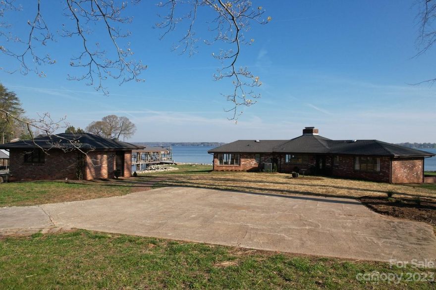 The pictures do not do this property justice.  All I can say is "Water Frontage for DAYS"! There are very few lots where you can actually see the sun rise as well as watch it set.  Miles of main channel water views await the lucky buyer of this stunning "NO HOA" waterfront cottage. Awesome Dock. This property is being sold as is.  Updates in 2022, were new Well, New Septic system, remodeled the Kitchen, plumbing enhancement and electrical enhancements.   Jet ski docs do not go with the property and have been removed.