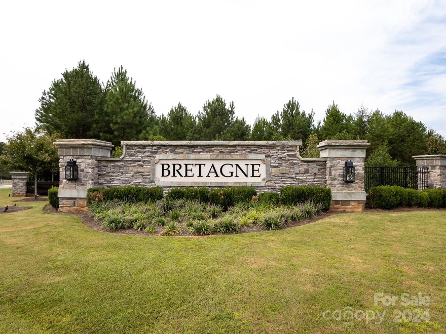 Rare find …..like new 1.5 story with Primary Bedroom & Guest Bedroom on Main Level. Beautiful two story Foyer greets you at the front door.  Gourmet Kitchen w/farm sink & 5 burner gas range plus huge island & beautiful backsplash. Kitchen opens to Great Room which has an abundance of natural light. Extended Primary Bedroom w/ tray ceiling features luxury bath with separate vanities & tremendous full glass, walk-in shower. Great Room is open to the Kitchen & the lovely Dining Room w/tray ceiling is adjacent. Laundry Room on the Main Floor w/a handy utility sink. Many other upgrades: including hardwood floors on main level, oak treads on stairs w/iron ballisters, & Venetian marble vanities in Baths. French doors off of breakfast area open to covered Lanai with extended Patio.  Premium, cul-de-sac lot w/tree buffer for ultimate privacy. Great storage w/walk in attic space off of both upstairs Bedrooms plus added shelving storage in garage.  Lovely green space right out your front door!