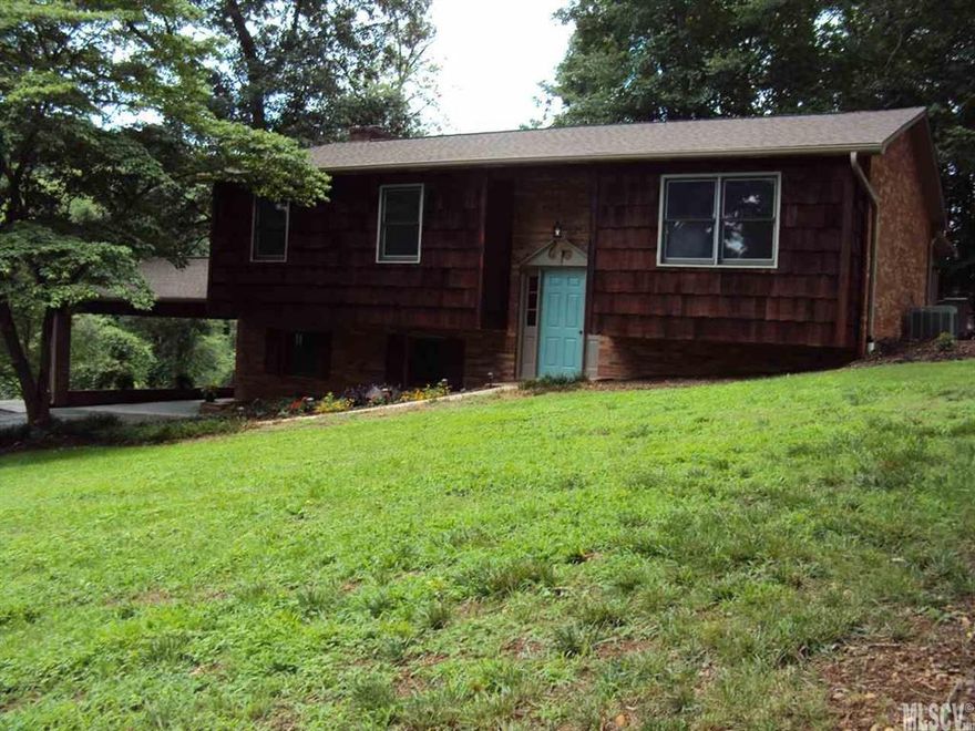 Lots of updates have been completed on this 3 bedroom 2.5 bath home. A new roof was just installed. The cedar shake shingle were just stained. There was new carpet installed on the main level of the home. New light fixtures. This home is move in ready. The lower level offers a nice large den with a masonry fireplace. This level offers a half bath that also doubles as a laundry room. The main level offers a nice living area. The eat in kitchen offers an abundance of cabinets. The cabinets are topped with a solid surface counter top. From the dining area you can access you large screened porch. Just off the screened porch you will find your patio with a built fire pit. This property also offers a detached 30 x 41 garage/workshop. This building has many possibilities.