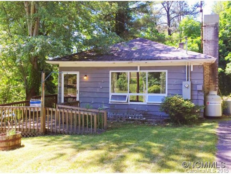 $28K priced below appraisal!!!Attention Investors and Farmers!!! 8 gently rolling acres with a charming 2 bedroom 1 bath home. Homes has been used as a rental in the recent past. Conveniently located to Patton Ave and New Leicester Hwy. Within minutes of Haywood. SELLING AS IS. The perfect spot for a small farm or garden. Unfinished Basement could expand square footage to have larger home. New painted interior.  Build your dream home on the acreage while you enjoy the cottage below.