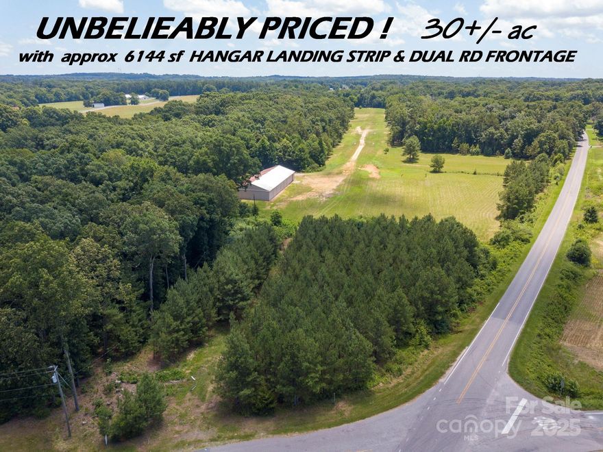 Approximately 3.5 miles from Downtown Monroe -ONE OF A KIND - 30+/- acres INDLUDES HUGE 128 x 47 x 11'h  Airplane Hangar with 200 Amp Service, The 3 Rolling Bay Doors (wide enough to accommodate a Cessna Plane), can also use as a Garage for RVs, Horse Trailers - Multiple Cars - Tractors, etc.   Current Access on Macedonia Church Rd. is a Gated Wooded Private Drive that Leads to a level PLANE RUNWAY currently used for Practice Landings and Take Offs for Jaars Pilots. The 30+/- acres was also used as horse pasture in the past. The 30+/- acres is part of a 40+/- acre parcel also has road frontage on Medlin Road that will have to be resurveyed and perked if you and wish to build more than one home and possibly subdivide. Seller will not sell less than 30+/- at this time.  If you wish to purchase more land (10+/- remaining acres) with an existing Custom Energy Efficient Home, Barn and existing fenced pasture please see MLS 4267802 which represents the entire 40+/- acres.  MLS 4267802 is ONLY AVAILABLE REPRESENTING THE ENTIRE 40+/- ACRES.  AT THIS POINT THE 10+/- ACRES, HOME, BARN AND PASTURE WILL NOT BE SOLD FIRST.
You must make an appointment and DO NOT ENTER PROPERTY DUE TO ACTIVE LANDING STRIP.




 CALL LA for DETAILS
SEE MLS 4326176 IF YOU WISH TO PURCHASE ONLY