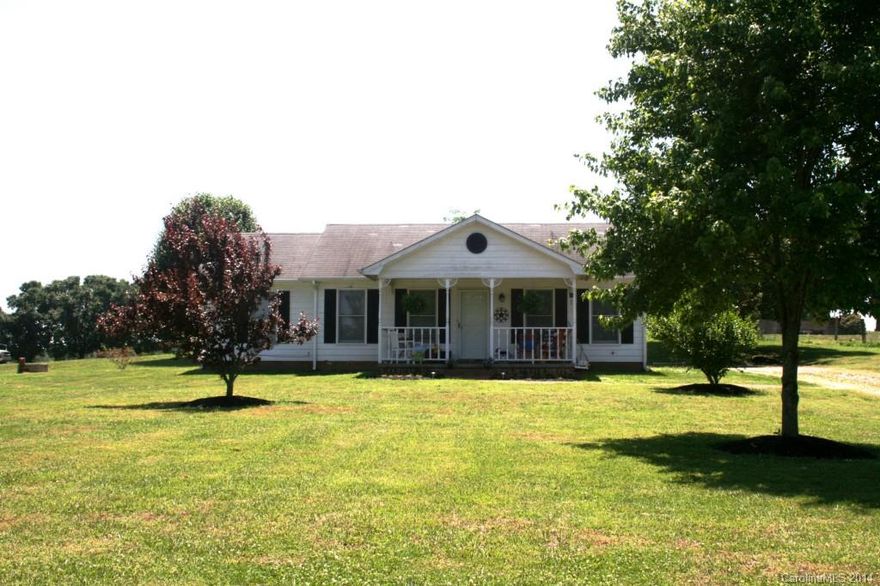 COME TO THE COUNTRY! Rocking chair porch, spacious greatroom with wood floors, split bedroom plan, private master suite, eat in kitchen, good cabinet space, beautiful view from deck, large back yard, oversize two car garage, great landscaping, convenient to Monroe, BRAND NEW HVAC and more!  Hurry, won't last!