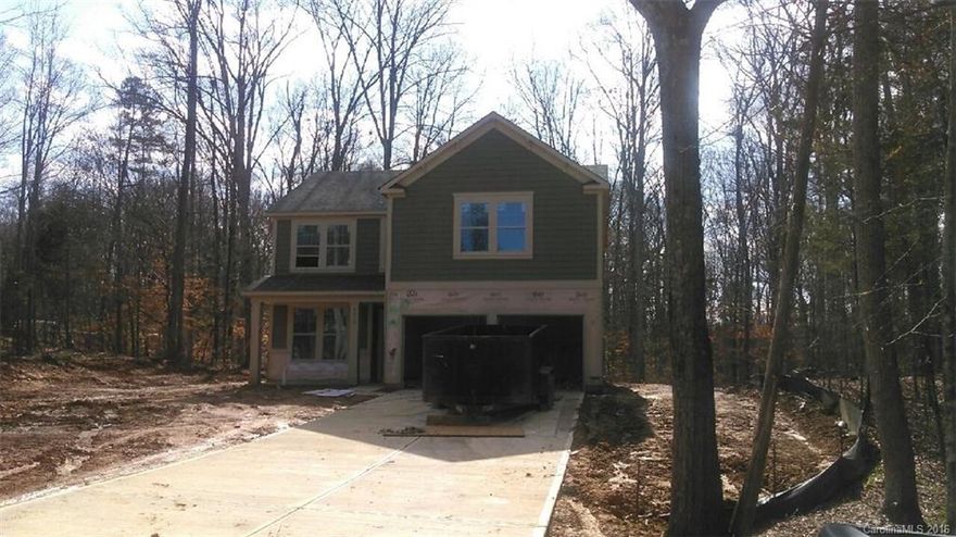 Beautiful home Located in quiet established community.  Wooded lot.  Many upgraded features in this 4BR home.  Upgraded flooring throughout.  Island in kitchen with breakfast seating.  Granite throughout.  Stainless appliances with gas range, microwave and dishwasher.  Drop Zone in mud room.  Master bath has dual sinks, ceramic surround separate garden tub and shower.  Walk in closets.