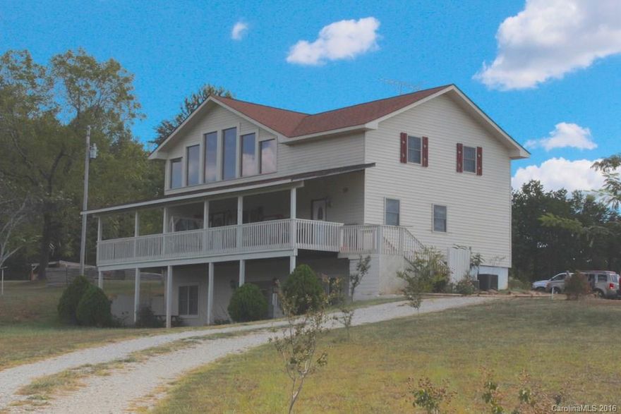 This home sits on a hilltop, off the road and the location provides great mountain views. The front porch is 10' deep and extends across the front of the house. The front door brings you into a large family room with hardwood floors and a fireplace. The main level has a master suite.  The basement is finished and has a kitchen, family room, two bedrooms and a full bath. They have added a barn and fenced most of the acreage with woven wire fencing.