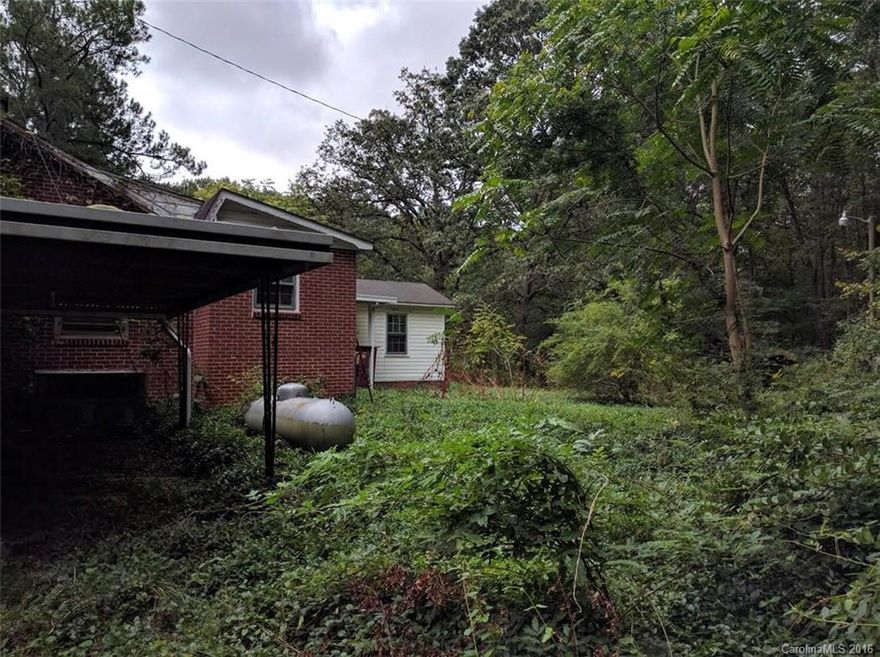 Country living on 3 acres with privacy galore! Lots of hardwoods in this area and much potential. Home is in disrepair and needs work. Being sold "as is".