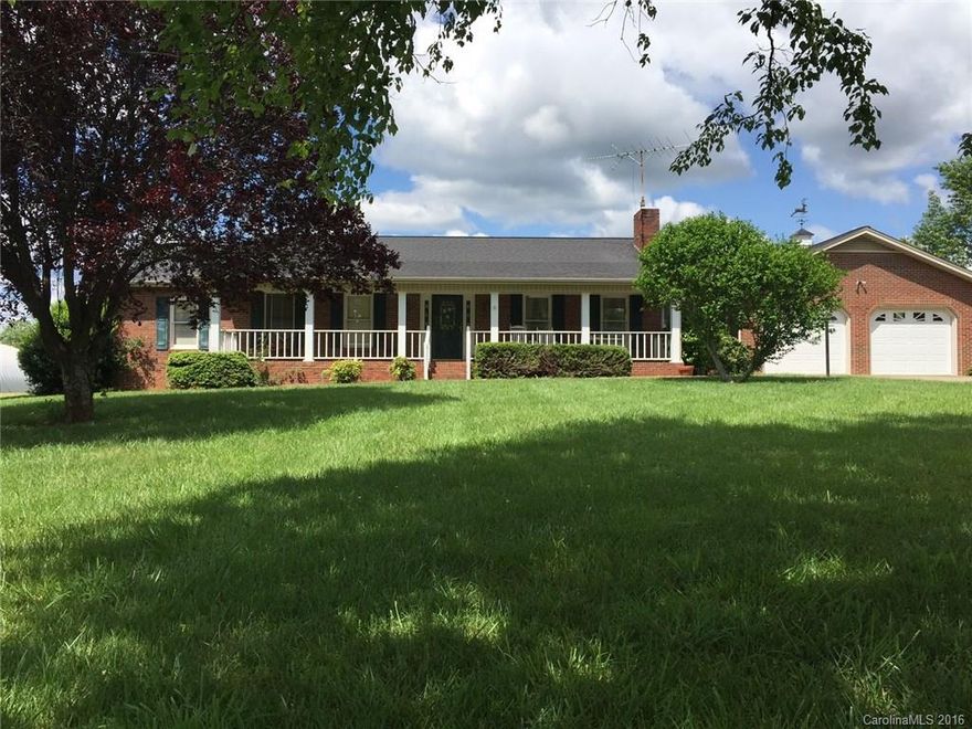 Well built all brick ranch on 3.46 acres. 2 car garage as well as an additional 2 car detached garage/shop and carport. Large fireplace with gas logs in Living room, covered front porch and back deck overlook beautiful yard. Sunroom area,  Oak cabinets in the kitchen with corian countertops. Central vac system. This home has been well taken care of and is ready for your personal touch.