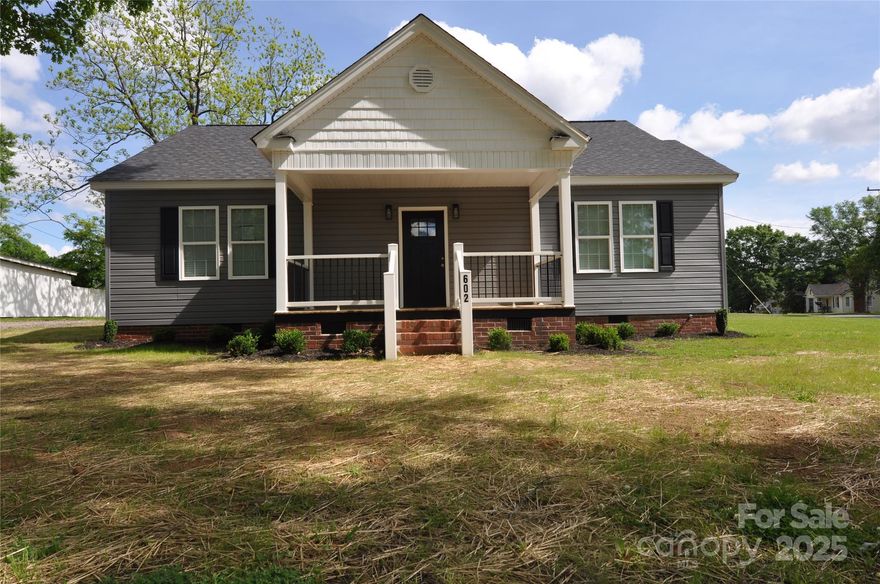 This stunning 1,752-square-foot home features three bedrooms and two bathrooms, situated on a corner lot in the desirable Robin Circle neighborhood. The property has been completely updated with new electrical systems, plumbing, HVAC, a tankless water heater, fixtures, vanities, windows, doors, and insulation. Enjoy sipping iced tea on the covered front porch or entertain guests on the covered back patio, perfect for grilling. The spacious kitchen boasts granite countertops and soft-close cabinets, complemented by stainless steel appliances. Luxury vinyl plank flooring for a sleek and modern look. Master bedroom includes his/her closets, while master bathroom features a convenient tub and shower combo. The living room is equipped with recessed lighting and has a large opening that leads to the foyer. The seller provides a clear CL100 inspection report. Don’t miss the opportunity to own this gorgeous home.Enjoy county taxes while being conveniently located near Charlotte and Columbia.