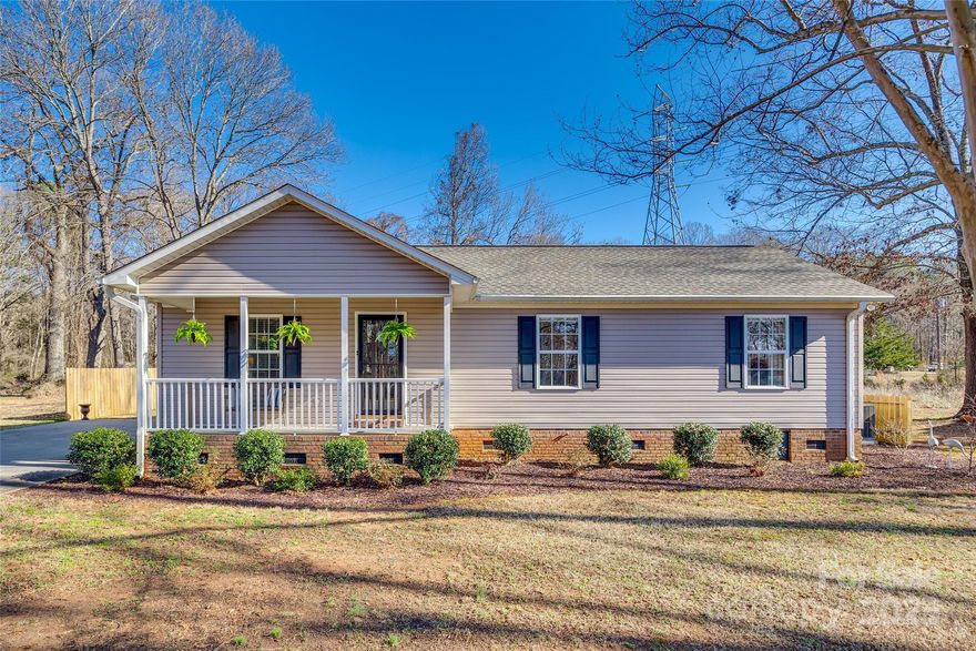 Nestled on a serene half-acre lot, this meticulously maintained ranch home offers a peaceful retreat while remaining close to the charm of historic downtown York and York Comprehensive High School. The inviting rocking chair front porch provides a perfect place to relax, while the screened-in back porch offers a private oasis for enjoying the outdoors in comfort. Inside, the home features three spacious bedrooms and two full bathrooms, with beautiful vinyl plank flooring throughout. The modern kitchen boasts sleek granite countertops and stainless steel appliances, making it a true focal point. A wired barn/shed adds practical storage space, ideal for hobbies or projects. With its combination of privacy, convenience, and thoughtful updates, this property is the perfect place to call home.