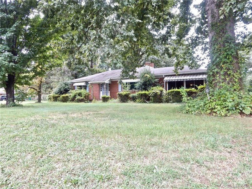 Full brick ranch with new gas pack and newer vinyl windows, water heater. Updated kitchen with Parapan and wood cabinets includes all appliances. Two fireplaces, Original wood floors under carpet. Storage building has electricity. Extra tall carport great for RV, truck or trailer parking. Total acreage includes next door lot, parcel id 045-080-08. This parcel is included in the sale. No known issues, property sold as-is.