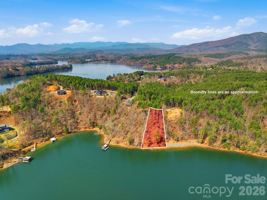 Lakefront lot located in the gated community of The Peninsula at Lake James, offering the perfect setting to build your dream home. Enjoy beautiful water and mountain views from this homesite. Community amenities include a day dock, swimming pool, and convenient boat storage. The community offers a shared well, adding to the ease of building. Ideally located just a short drive to both Morganton and Marion, you’ll enjoy the perfect balance of privacy and accessibility.