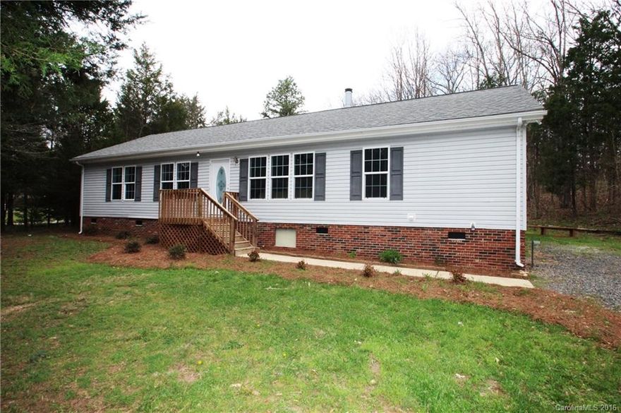 Totally remodeled in Pristine condition!! This 3 bedroom 2 bath split floor plan features on site finished hardwood floors in the living room, dining room, & hallway.  New carpet in all 3 bedrooms. New Interior paint.  New light fixtures/fans.  All bedrooms have walk in closets.  Huge kitchen w/ island,lots of cabinet space, new hardware on the cabinets.  Huge master suite features dual vanity sinks, new tile floors, garden tub, walk in closet.  Huge deck that overlooks a wooded lot in back.