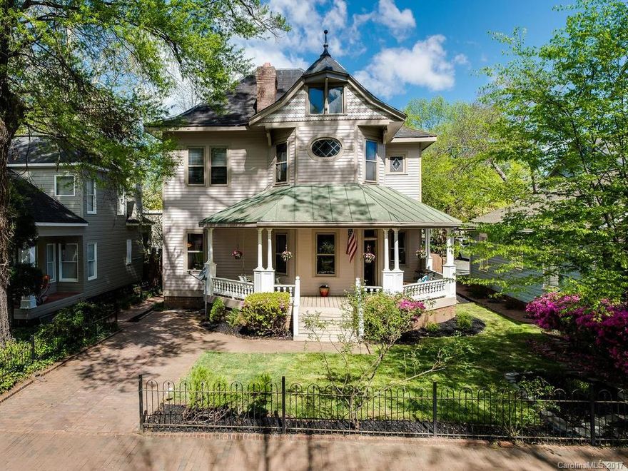 This Victorian catches every eye that passes! Step right into the foyer w/ inviting FP & bay windows. So many original features, stained & beveled windows, 6 fireplaces, Viking appliances, updated kitchen, wood floors, original interior wood doors, slate roof, new master addition w, copper tub, 10ft ceilings up & down, private backyard is an oasis w/ water fountain and front porch wraps front of house.. relax on either side! Walk to center city, all sports venues, bars, dining. Character abound!
