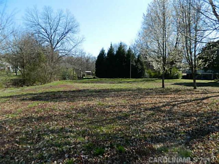 Nice corner lot with creek running across property. Convenient to mall, hospital, and restaurants. Property can be rezoned for commercial use