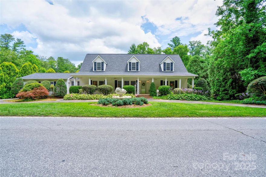 Spacious and versatile 4BR/3BA home in historic Flat Rock on a beautifully landscaped .37-acre lot. This well-designed 2-story offers a split-bedroom floor plan with primary suites on both the main and upper levels—ideal for privacy or multi-generational living. Features include a living room with gas-log fireplace, formal dining, breakfast room, sunroom, and main-level laundry. Upstairs includes a bonus room and sitting area—perfect for a home office or flex space. Enjoy outdoor living on the rocking chair front porch. Oversized 2-car garage, circular drive, and ample storage throughout. Used as a second home and well maintained. Conveniently located near Bon Clarken Conference Center, shopping, dining, and Flat Rock attractions. A flexible layout and fantastic location make this home a must-see!