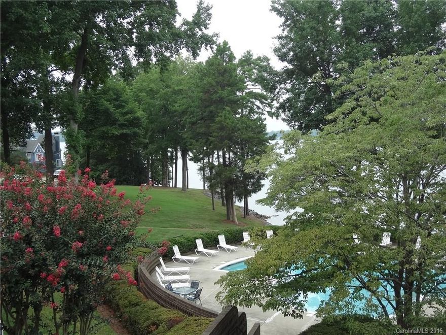 Light filled end unit w/private balcony w/pool & lake views.  Kitchen w/breakfast bar opens to living/dining areas featuring bamboo look floors, a columned half wall, wet bar & fireplace. Granite counters in baths & kitchen. Newer lights & stainless steel appliances, 5 yr old Heat Pump. Amenities include lake side pool, day boat dock, sports courts (tennis, volleyball etc), walking & fitness trails. Boat slips for lease too! Easy access to I-77, restaurants & the quaint town of Davidson!